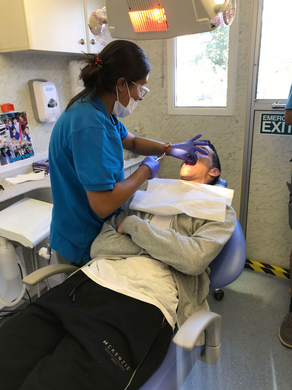 Dentist Nafiza treating a patient for Kitchen for Everyone York