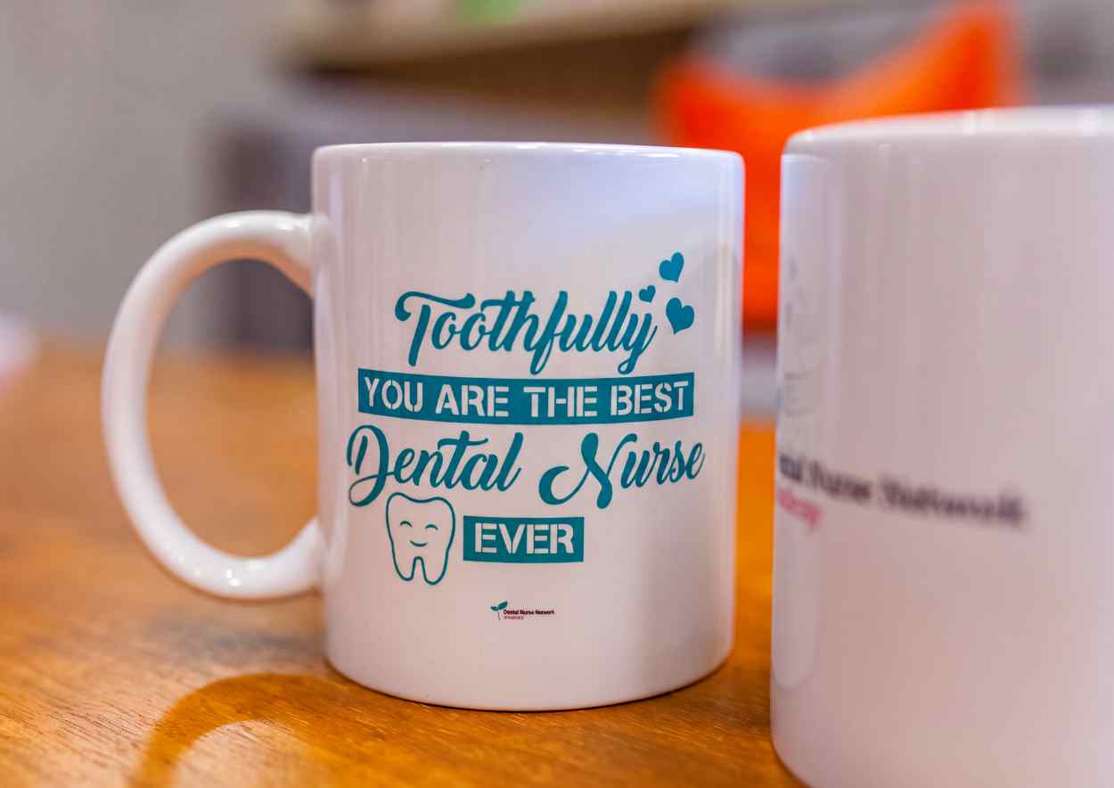 Toothfully you are the best dental nurse ever mug on a wooden desk